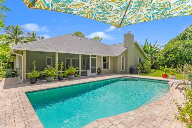 view of pool featuring a patio and ceiling fan