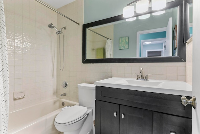 full bathroom with tile walls, tasteful backsplash, shower / tub combo, vanity, and toilet