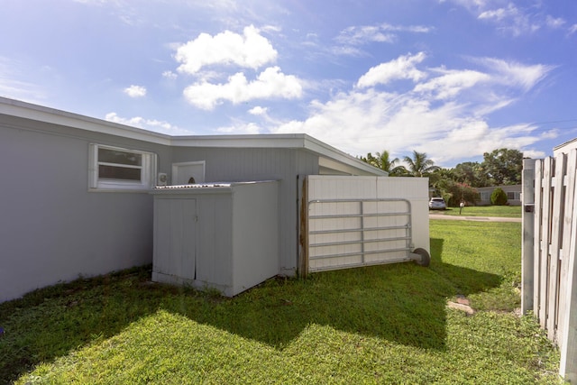 view of outbuilding featuring a yard