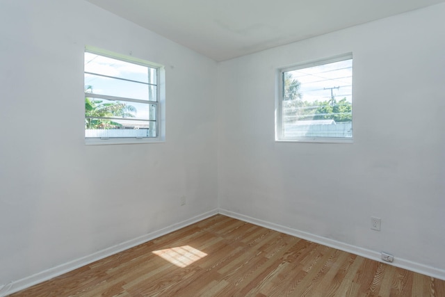 spare room with light hardwood / wood-style floors