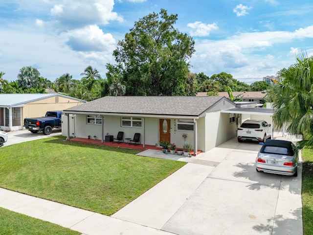 single story home with a front yard and a carport