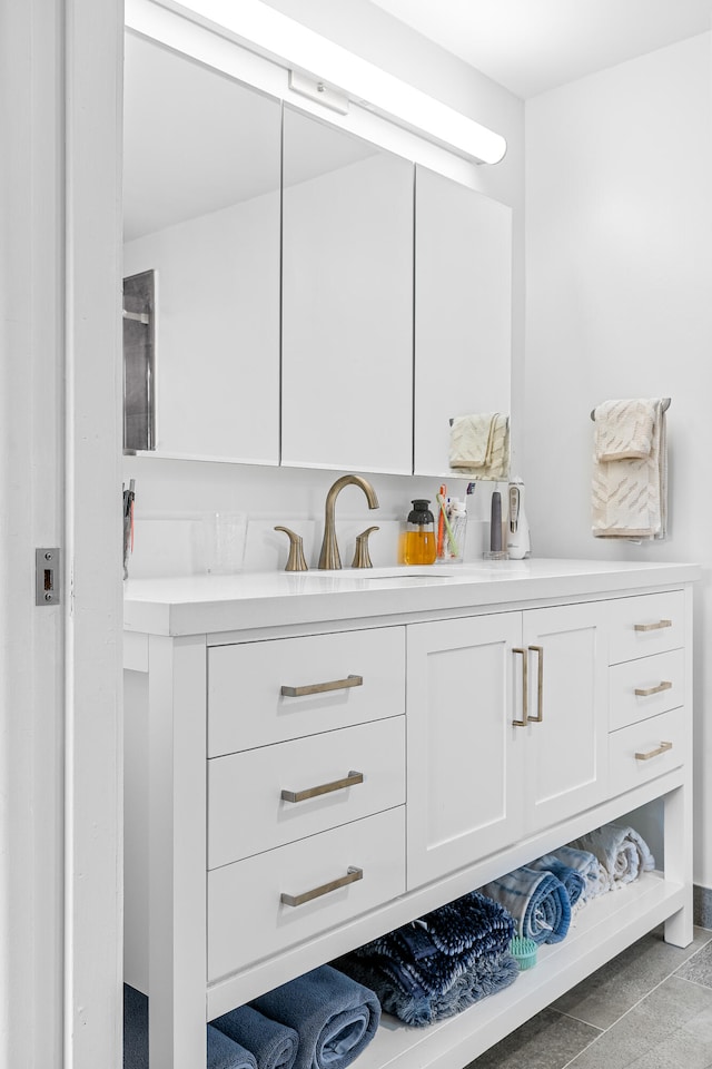 bathroom with vanity and tile patterned floors