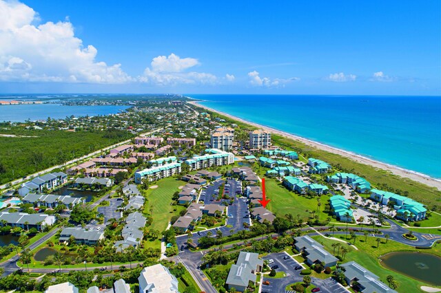 aerial view featuring a view of the beach and a water view