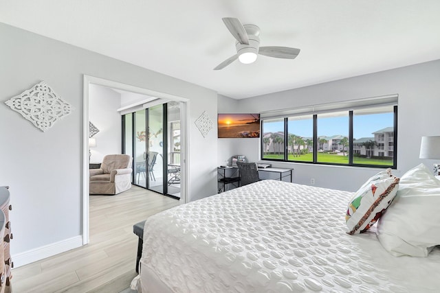 bedroom featuring access to exterior, ceiling fan, and light hardwood / wood-style flooring