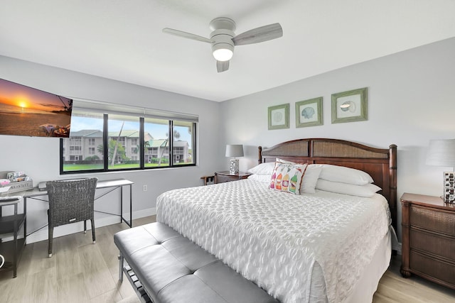 bedroom with ceiling fan and light hardwood / wood-style floors