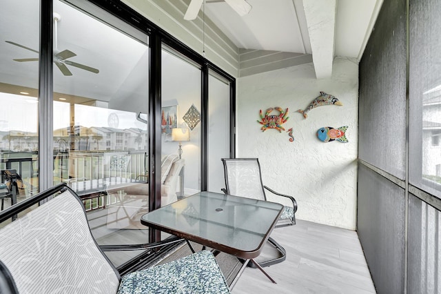 sunroom / solarium with a healthy amount of sunlight and ceiling fan