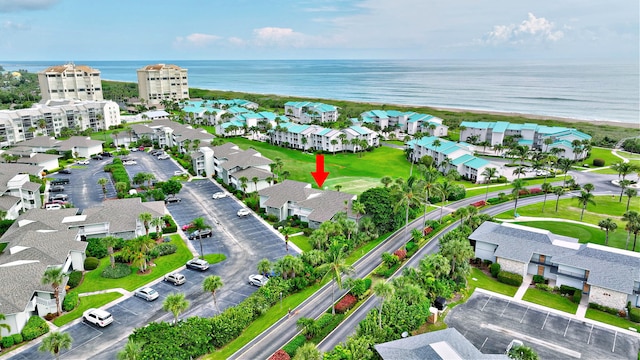 drone / aerial view featuring a water view and a residential view