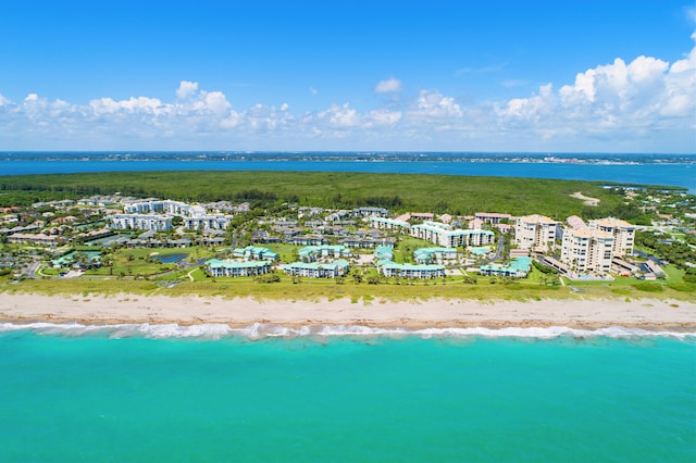 bird's eye view with a view of the beach and a water view