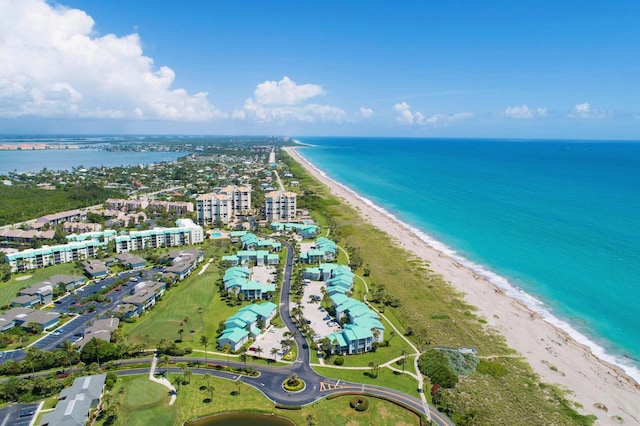 aerial view featuring a water view and a beach view