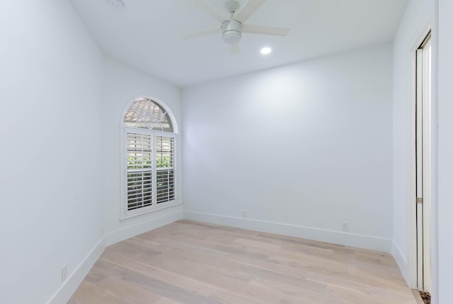 unfurnished room featuring ceiling fan and light wood-type flooring