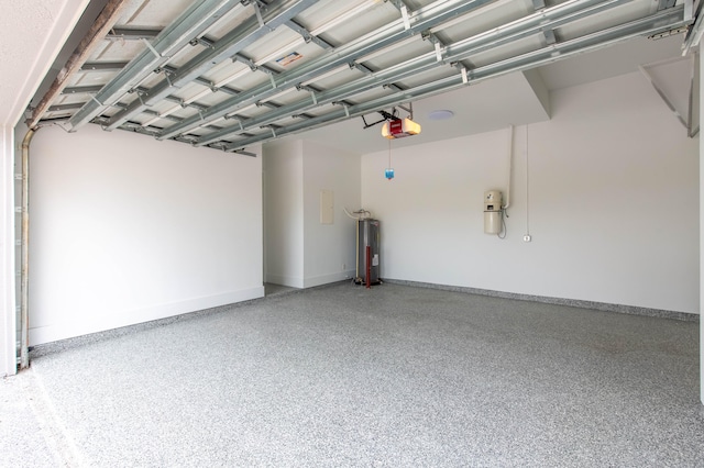 garage featuring water heater and a garage door opener