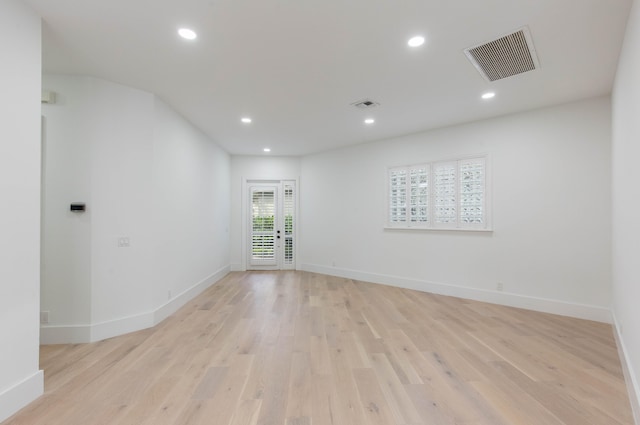 unfurnished room with light hardwood / wood-style flooring