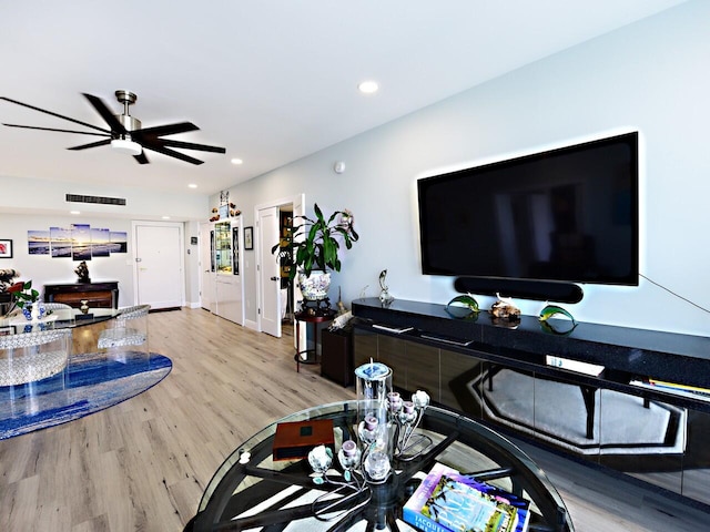 office featuring ceiling fan and light hardwood / wood-style flooring