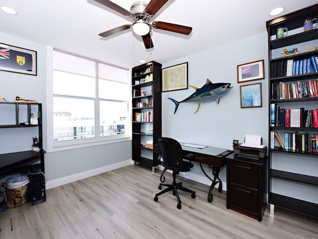 office space with light hardwood / wood-style flooring and ceiling fan