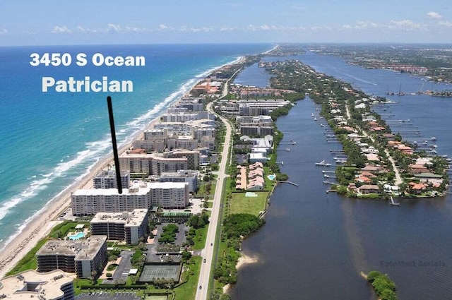 aerial view featuring a view of the beach and a water view