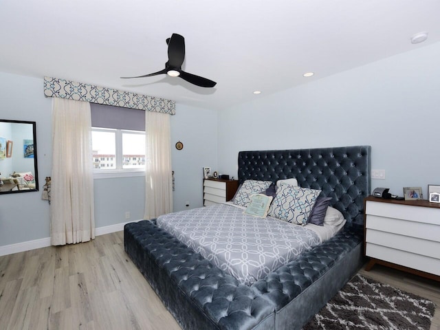 bedroom featuring hardwood / wood-style floors and ceiling fan