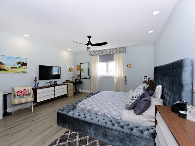 bedroom featuring ceiling fan and hardwood / wood-style flooring