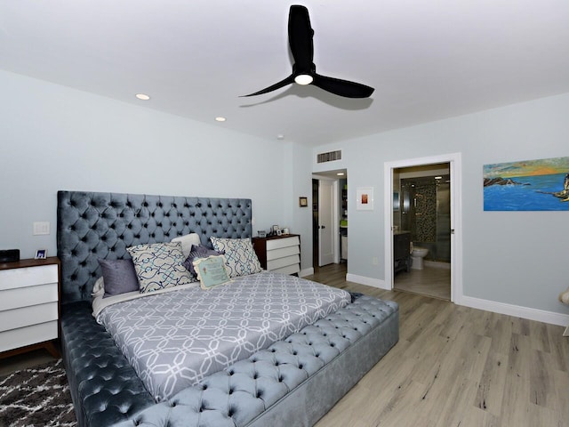 bedroom featuring wood-type flooring, ceiling fan, and connected bathroom