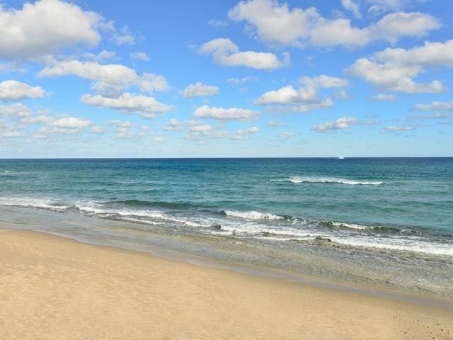 property view of water featuring a beach view