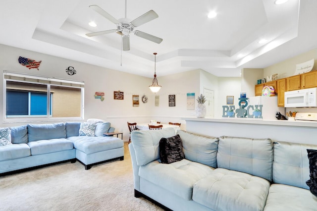 8010 Carnoustie Pl Unit 4022, Port Saint Lucie, FL 34986 - living room featuring a raised ceiling, recessed lighting, light colored carpet, and a ceiling fan