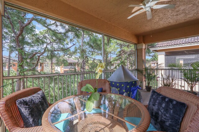 sunroom / solarium with ceiling fan