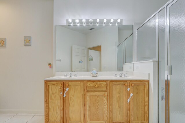 bathroom featuring walk in shower, tile patterned flooring, and vanity