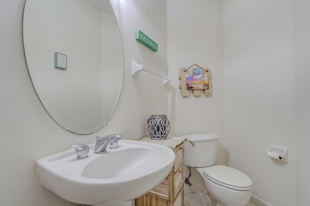 8010 Carnoustie Pl Unit 4022, Port Saint Lucie, FL 34986 - half bathroom with a sink, toilet, and tile patterned flooring