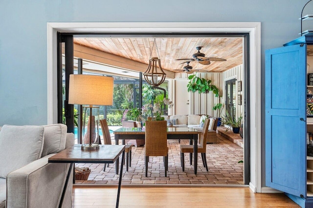 dining space featuring wood ceiling, light hardwood / wood-style floors, and ceiling fan