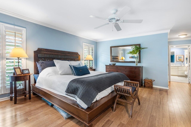 bedroom with light hardwood / wood-style flooring, connected bathroom, ceiling fan, and crown molding