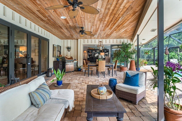 view of patio / terrace featuring a lanai and ceiling fan