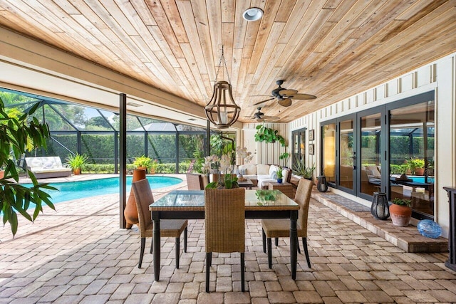 sunroom / solarium featuring wood ceiling and ceiling fan