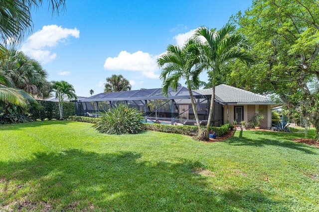 view of yard featuring a lanai