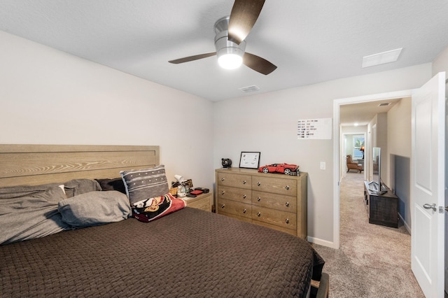 bedroom with light carpet and ceiling fan