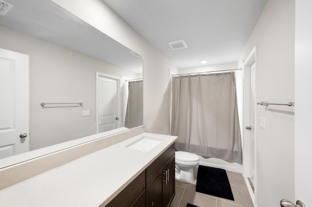 full bathroom with tile patterned flooring, vanity, toilet, and shower / bathtub combination with curtain