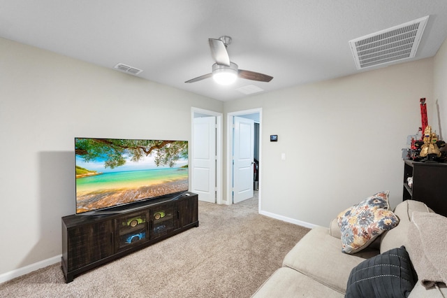 living room featuring carpet flooring and ceiling fan