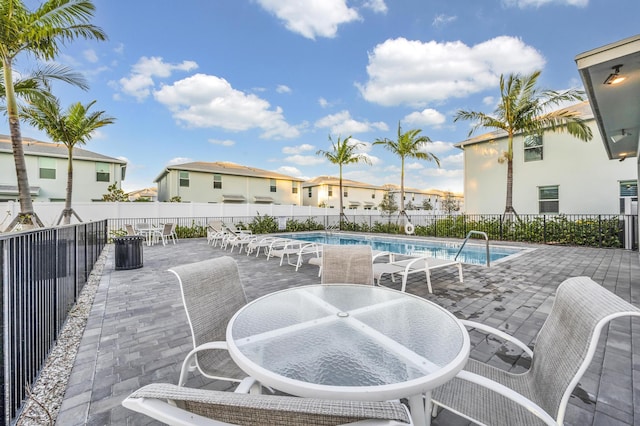 view of patio / terrace featuring a community pool