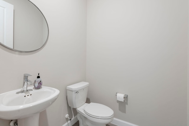 bathroom with toilet and sink