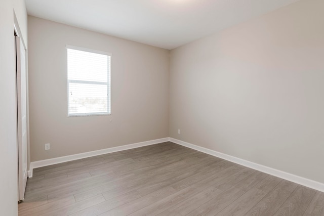 spare room featuring light hardwood / wood-style floors