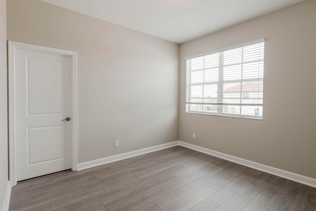 spare room with light wood-type flooring