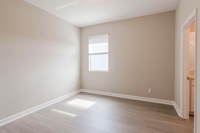 spare room featuring light wood-type flooring