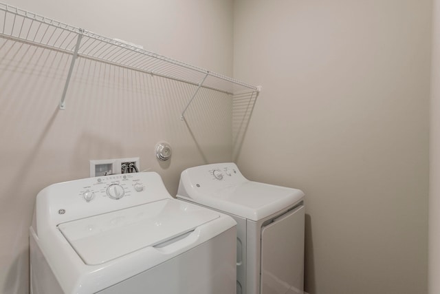 laundry room featuring washer and clothes dryer