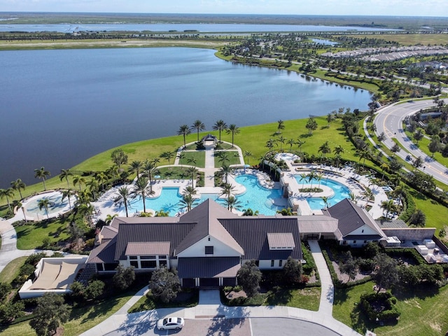 birds eye view of property featuring a water view