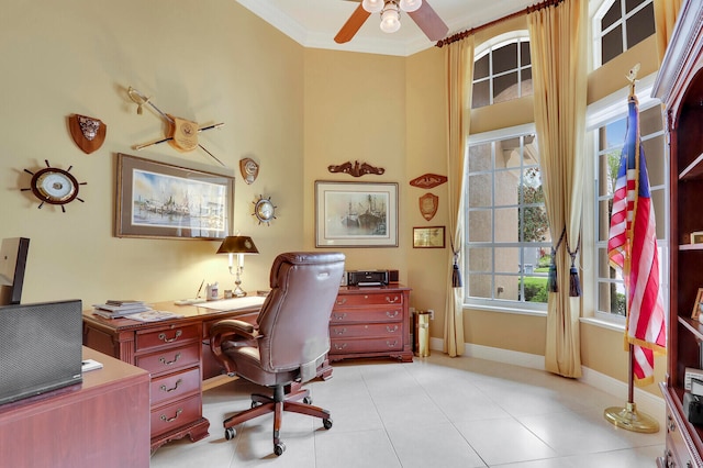 tiled office space featuring ornamental molding and ceiling fan