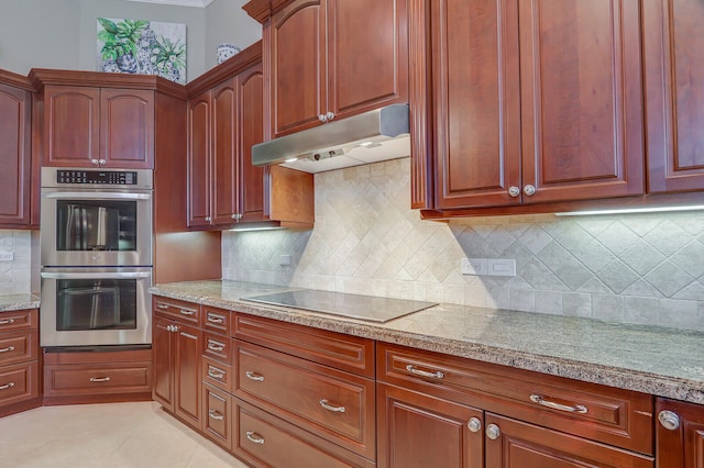 kitchen with stainless steel double oven, light tile patterned flooring, decorative backsplash, and black electric stovetop