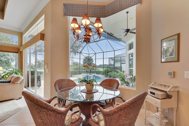 dining space featuring ceiling fan with notable chandelier, crown molding, a towering ceiling, and light tile patterned floors