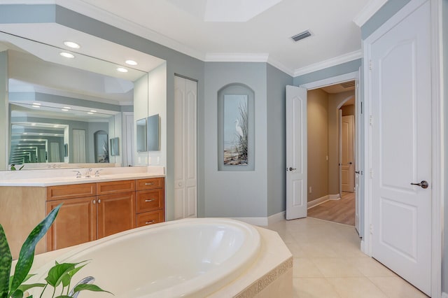 bathroom featuring a relaxing tiled tub, tile patterned flooring, vanity, and crown molding