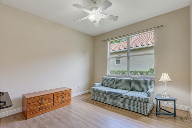 sitting room featuring light hardwood / wood-style floors and ceiling fan