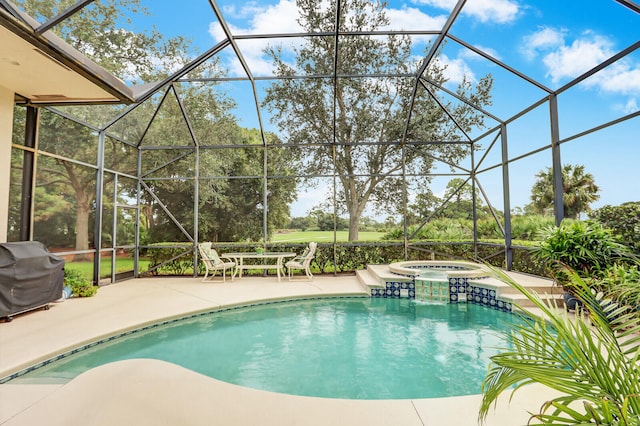 view of swimming pool with a lanai, a patio, an in ground hot tub, and a grill