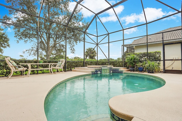 view of swimming pool with a lanai and a patio