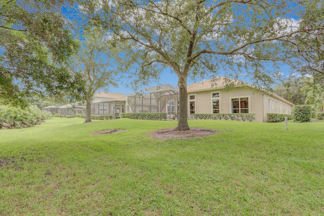 view of yard with a lanai